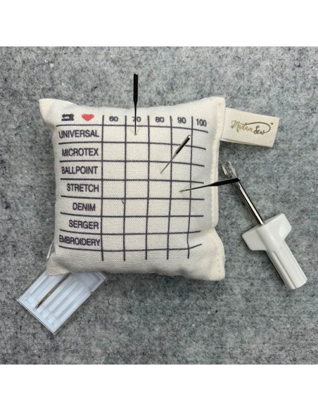 Cojín de clasificación para agujas de máquinas de coser