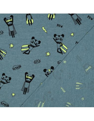 Tela de jersey jaspeado - Superhéroes amarillos sobre fondo azul