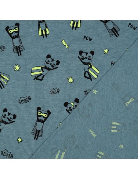 Tela de jersey jaspeado - Superhéroes amarillos sobre fondo azul