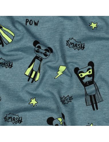 Tela de jersey jaspeado - Superhéroes amarillos sobre fondo azul