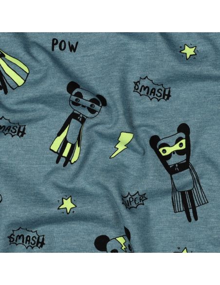 Tela de jersey jaspeado - Superhéroes amarillos sobre fondo azul